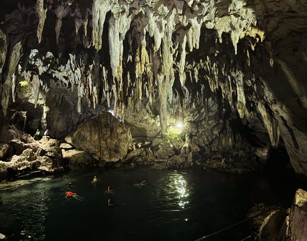 Shot of the Hinagdanan Cave and its clear water pool in the midle